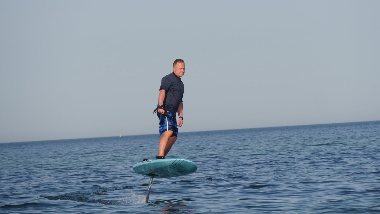 Andreas Lakeberg riding an eFoil on open water